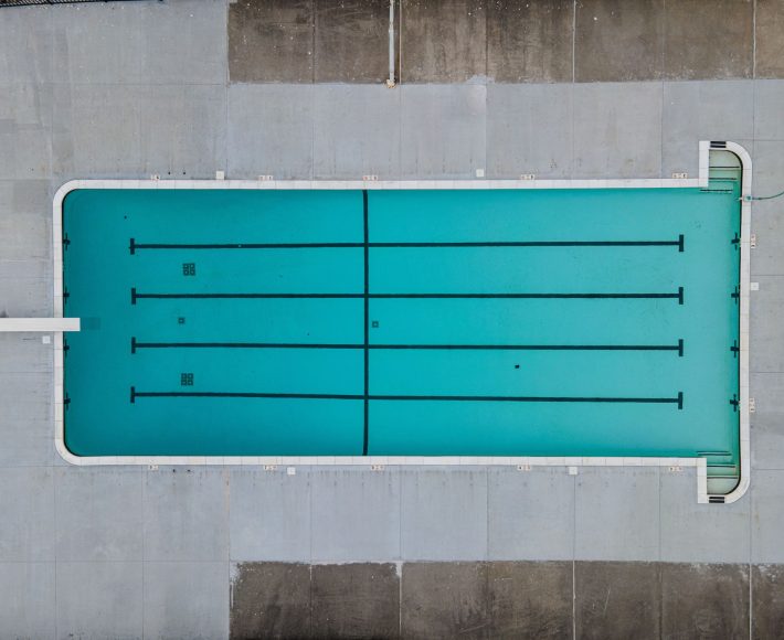 Aerial top view of an empty swimming pool